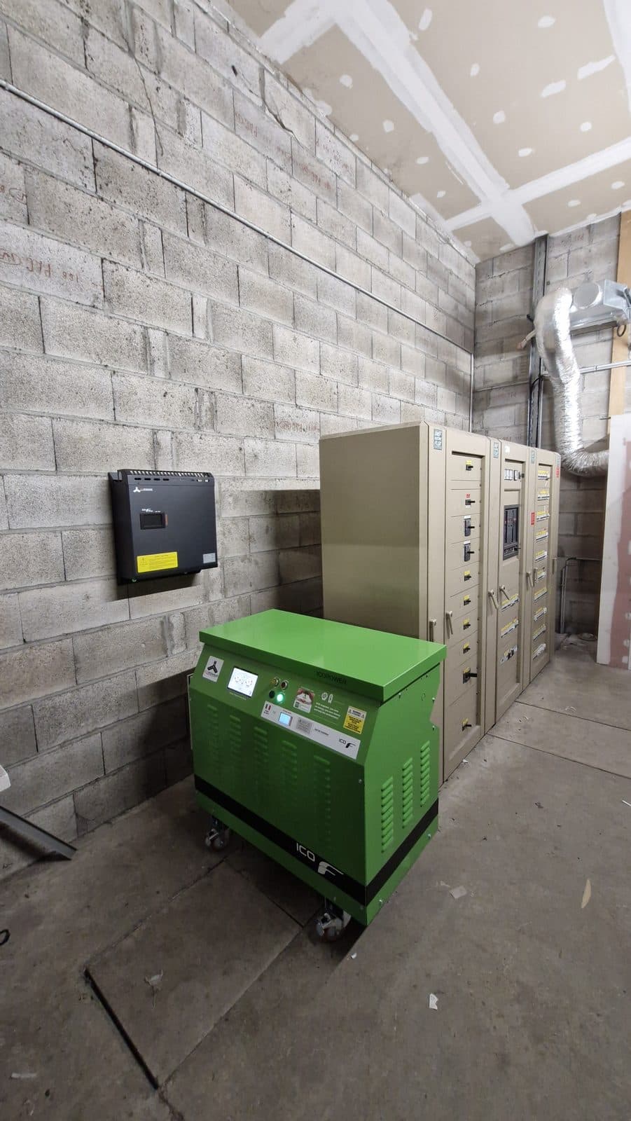 Icopower unit installed in a switch room with a wall-mounted cabinet